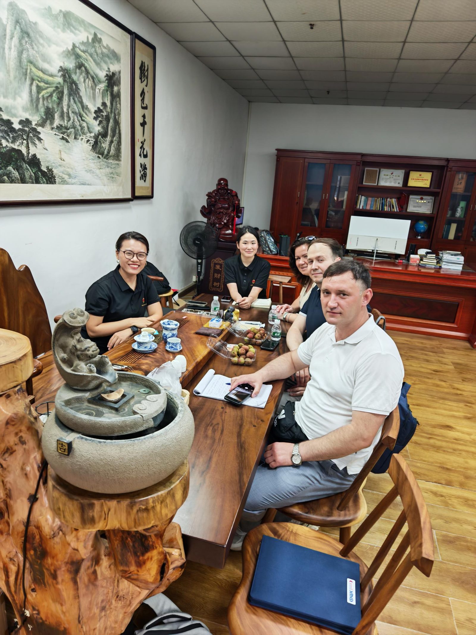 Overseas buyers reviewing packaging line options with WIN-WIN PACK in a meeting room in China